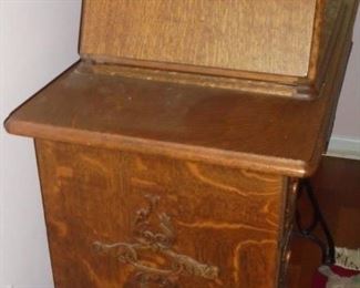 Exquisite antique singer sewing machine in Tiger oak cabinet