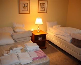Pristine linens, twin beds