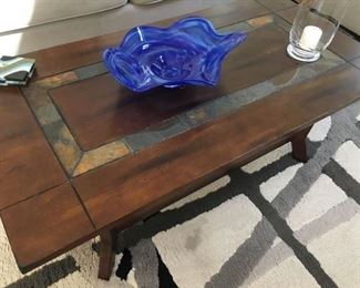 Coffee table with slate inset strips -shelf below .
