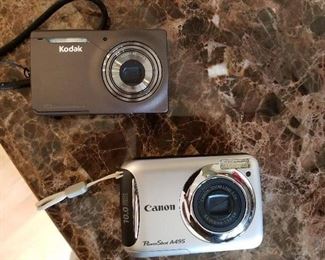 Kodak M1033HD and Canon PowerShot A495