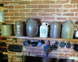 Pottery jugs. Cast iron.