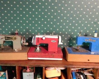 Miniature sewing machines.