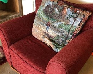 large red chair and fishing pillow