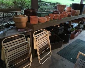 Great wooden garden table and lots of planters and pots