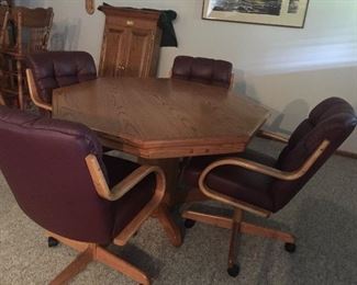 Game table and four chairs on castors 