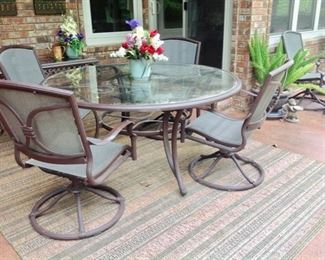 Round Patio Dining Table & 4 Swivel  Chairs,  and an Outdoor Carpet