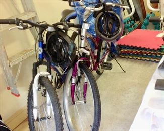 His and Hers Mountain Bikes w/Helmets