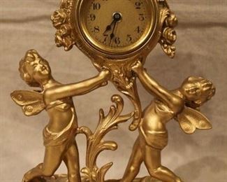 Antique cherub figure clock