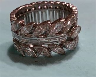This stunning diamond ring boasts 6.8 carats of diamonds set in platinum. The band is size 7. The diamonds are GH color and VS1 clarity. Appraised for just over $18,000 and is offered at $9000.