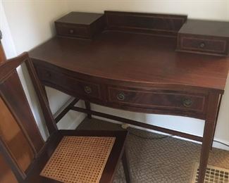 Desk - Located Upstairs
•	Writing
•	Dark Wood
•	Matching Caned Chair

