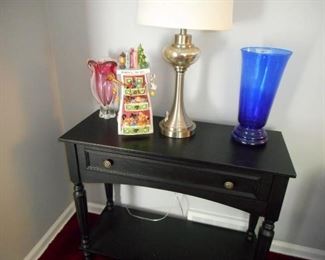 Side table with lamp and vases