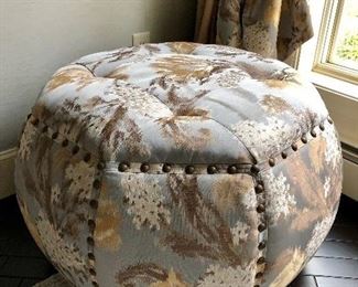 Giant nailhead trim adorns this octagonal ottoman!