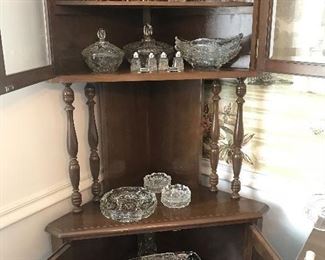 Corner cabinet and glass serving pieces.