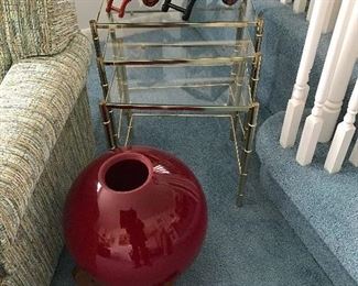 Red decorative light. Nesting tables.