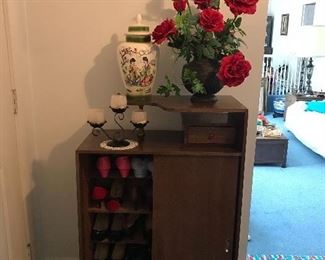 Vintage womens’ shoes, Large flower arrangement, ceramic vase and vintage candleholder.