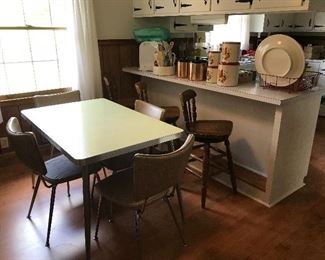 Mid century kitchen table and chairs. Boling wooden swivel counter stools. 