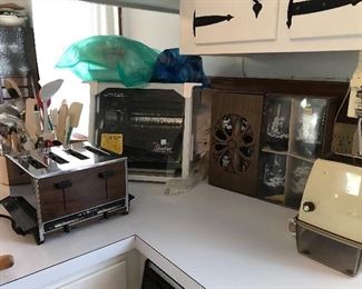 Ronco Showtime rotisserie with accessories (New). Libbey glasses (New), toaster, electric ice crusher, carrousel with utensils.