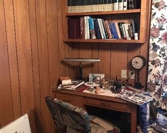 A beautiful swivel office chair with a book pattern in like new condition. A collection of Childcraft books in great condition.