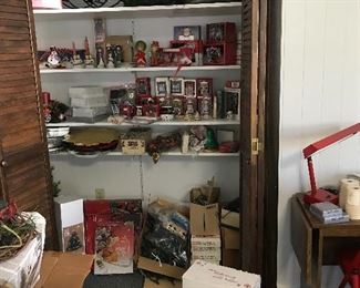 An assortment of Christmas ornaments (i.e. Hallmark, Fitz and Floyd, etc.) decorations, wreaths, serving platters, lights, etc. Some items are new. Lights have been checked and are labeled as working and not working.