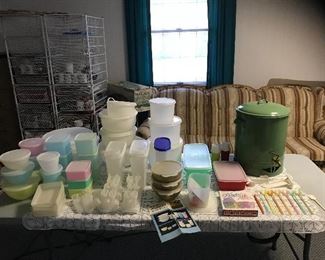 A collection of vintage and newer Tupperware. Some of the Tupperware is from Japan. Enamelware drink dispenser.