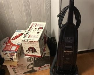 Dirt Devil vacuum and cordless handheld vacuum. Scunci steamer. Kenmore Hepa vacuum.