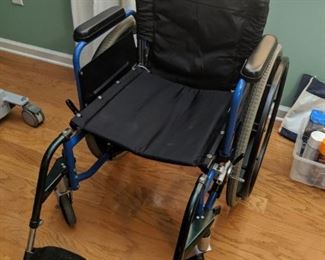 Portable wheelchair collapses for easy transport and storage