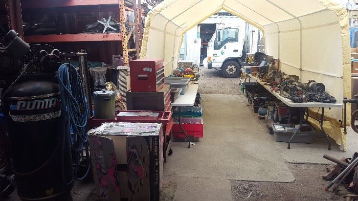 tent full of tools also air compressor , tile saw, craftsman tool box etc.