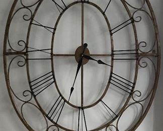 Large, decorative metal clock.