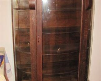 This cabinet was given to the owner's great grandmother after she was freed . She was once a slave in Georgia. Original curved glass and the key.