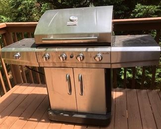 Large 4-burner Charbroil Grill with external burner, prep shelf and thermometer & rotissary. 