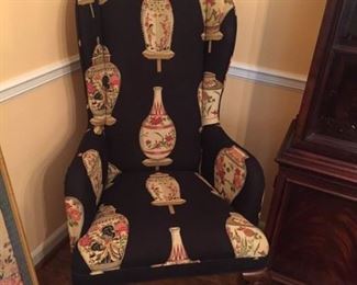 One of a pair of Black wing back chairs