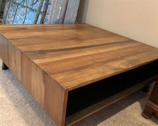#27	wood teck 4x4 custom made coffee table with storage under it on metal legs 	 $350.00 
