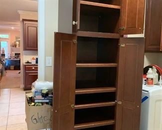 #62	cherry color wood pantry w 4 doors 6 shelves 24x24x96	 $150.00 
