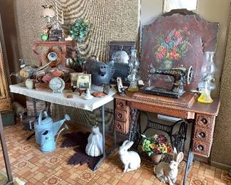 Vintage Singer pedestal sewing machine with cabinet