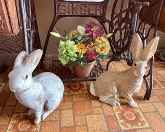 Two adorable concrete rabbits