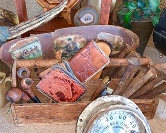Vintage toolbox with smoking pipes, leather tooled wallets, iron railroad spikes and more