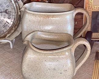 Large and small handmade pottery creamers