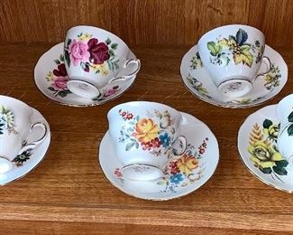 Set of five teacups and saucers