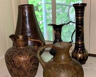 Metal jugs and vase