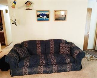 Living Room: Blue Couch, Japanese Pictures, Parrots