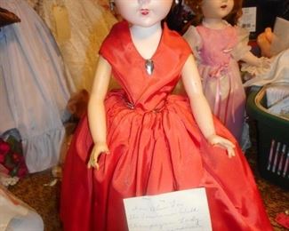 Madame Alexander 1957 the only year she was made and sold..ALICE L, She was the Champagne Lady on Lawrence Welk show..if you have no clue.>GOOGLE IT!