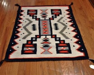 Storm, late 1970s, 32" by 48" - 4 corners lightning, water bugs; hand carded and home spun (grey is white yarn dyed); cord broken in 2 places.