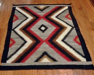 Eye Dazzler - 1930s-1950s, 33' by 50.5"; double border; black border breaks at end; homespun warp, mahogany dye; some damage
