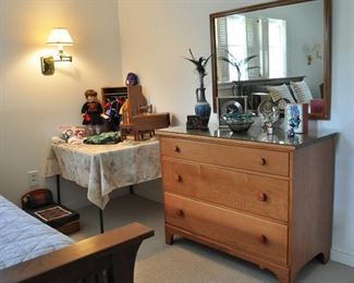 Crisp line well constructed maple dresser - coordinated mirror - glass top - There is a chest of drawers that is the same style as this dresser.