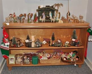 Apartment - Solid wood low bookshelf with antique nativity (mostly German pieces); also small German and Japanese buildings, trees and cast iron figures
