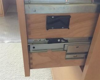 Solid dovetail constructed drawers with metal gliding hardware.
