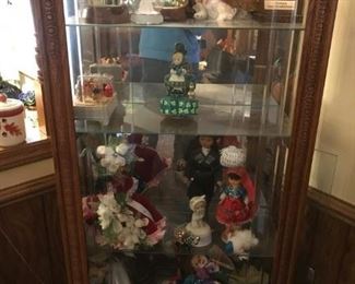 China cabinet filled with unusual collectibles