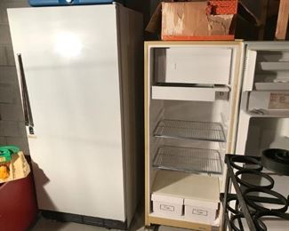 16 cu. ft. freezer next to a refrigerator and freezer 12.8 cu. ft. 