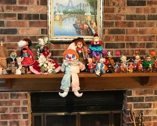 Glass dolls on top of fire place mantel
