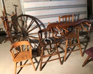 Antique wagon wheels, chairs and oxen yoke 